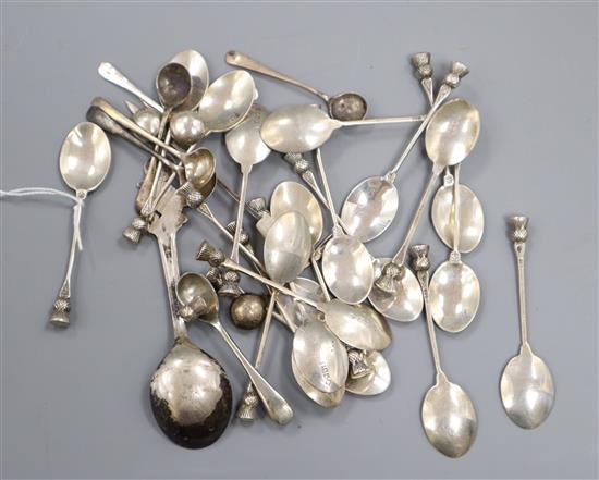 Twenty assorted Scottish silver thistle coffee spoons and seven silver salt spoons and three other items.